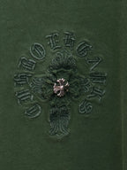 Green T-shirt fabric with detailed small embroidered cross logo