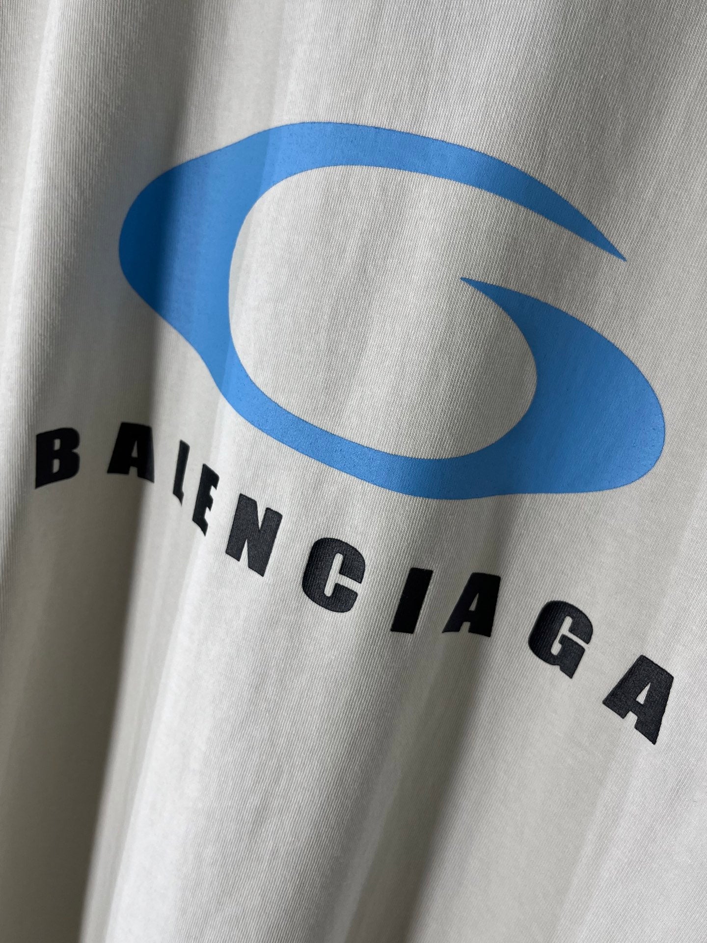 White T-shirt chest with large blue BALENCIAGA logo and black letters