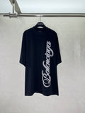 Balenciaga black T-shirt with large white script logo on the front