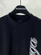 Balenciaga black T-shirt neckline and sleeve with white script logo print