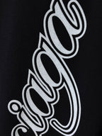 Balenciaga black T-shirt close-up of white outlined script letters