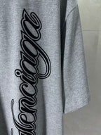 Heather gray T-shirt with large black cursive logo print on front