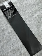 Heather gray T-shirt with black care label and size tag