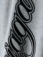 Heather gray T-shirt with oversized black cursive graphic close-up