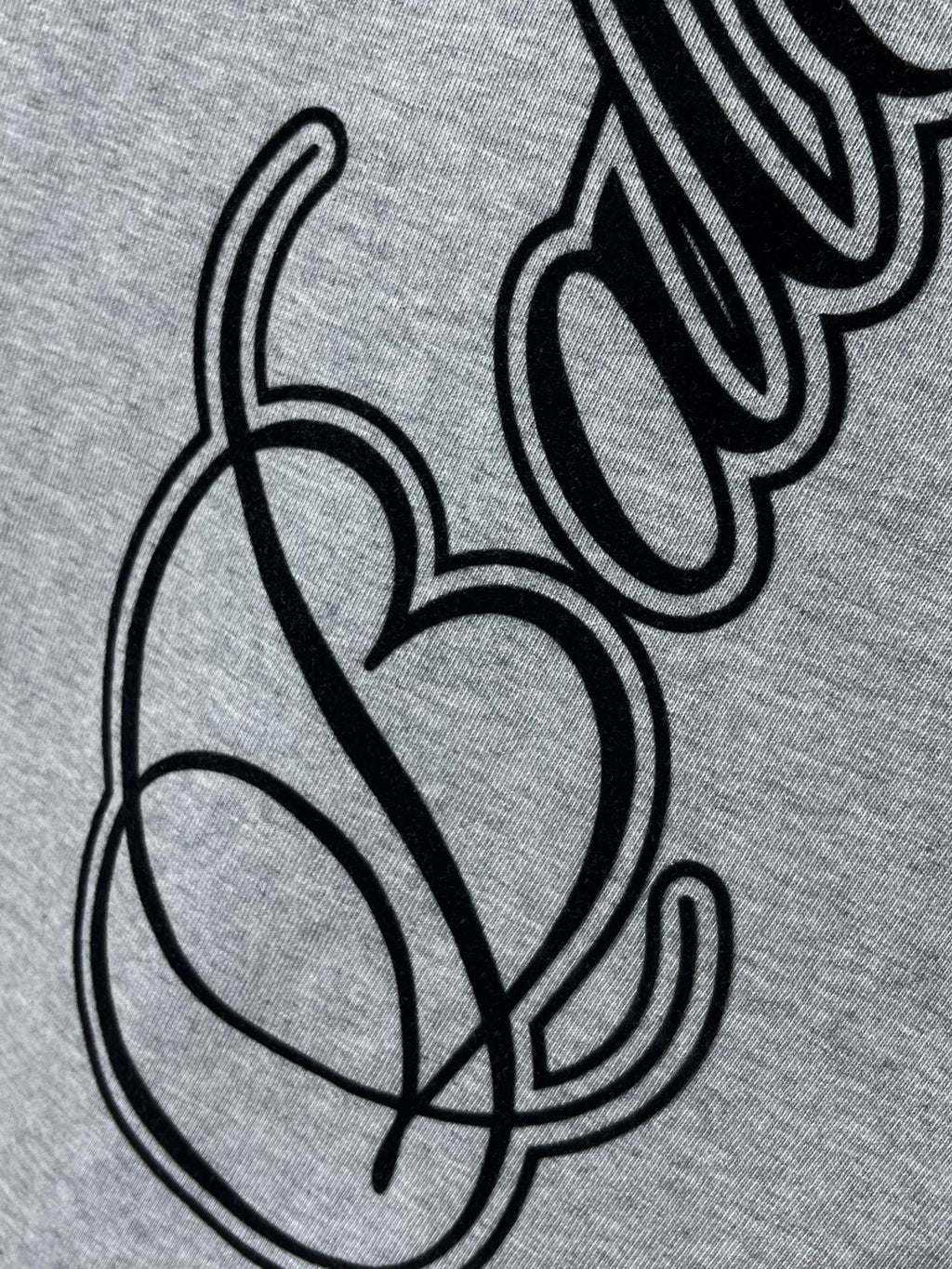 Heather gray T-shirt with black cursive and heart graphic detail
