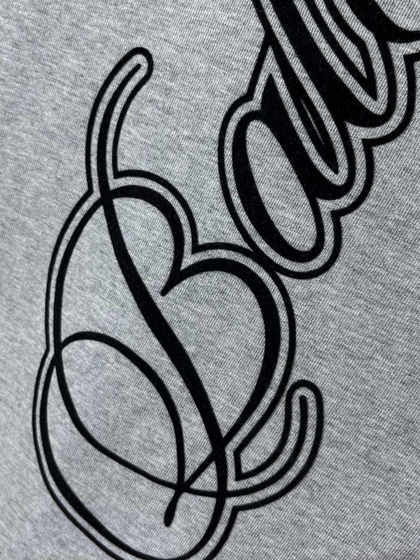 Heather gray T-shirt with black cursive and heart graphic detail