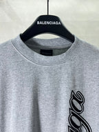Heather gray crew-neck T-shirt with BALENCIAGA logo and black script graphic