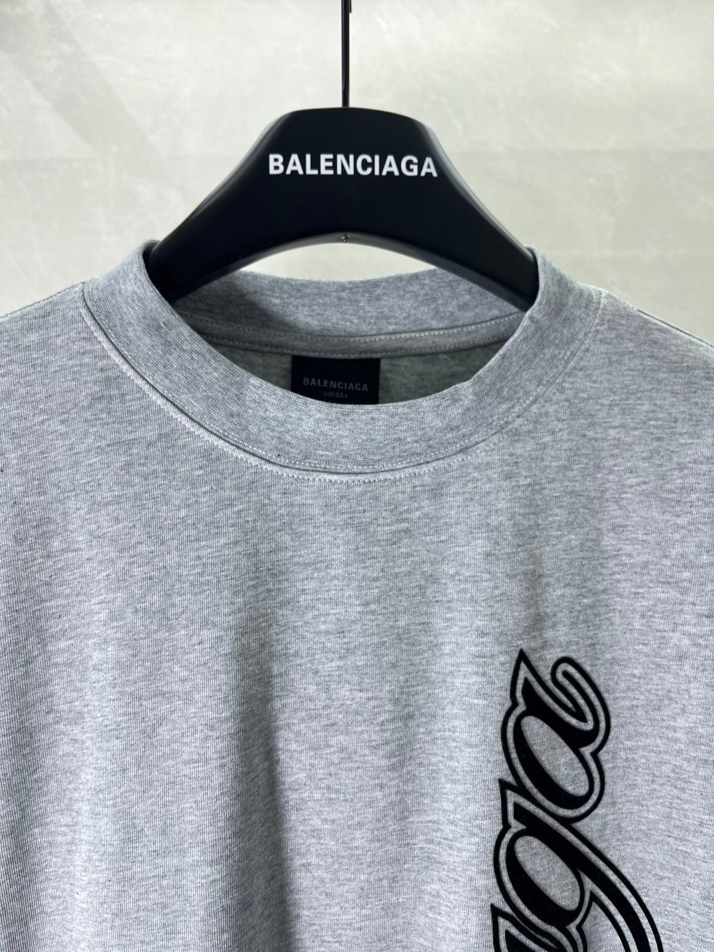 Heather gray crew-neck T-shirt with BALENCIAGA logo and black script graphic