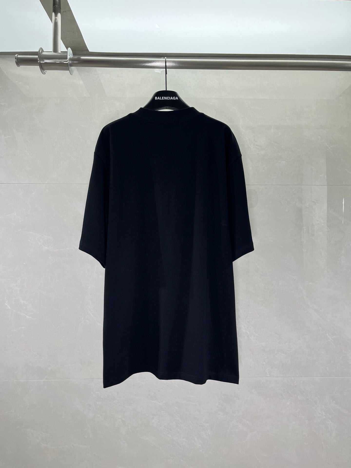 Balenciaga black T-shirt back view, plain with no visible graphics
