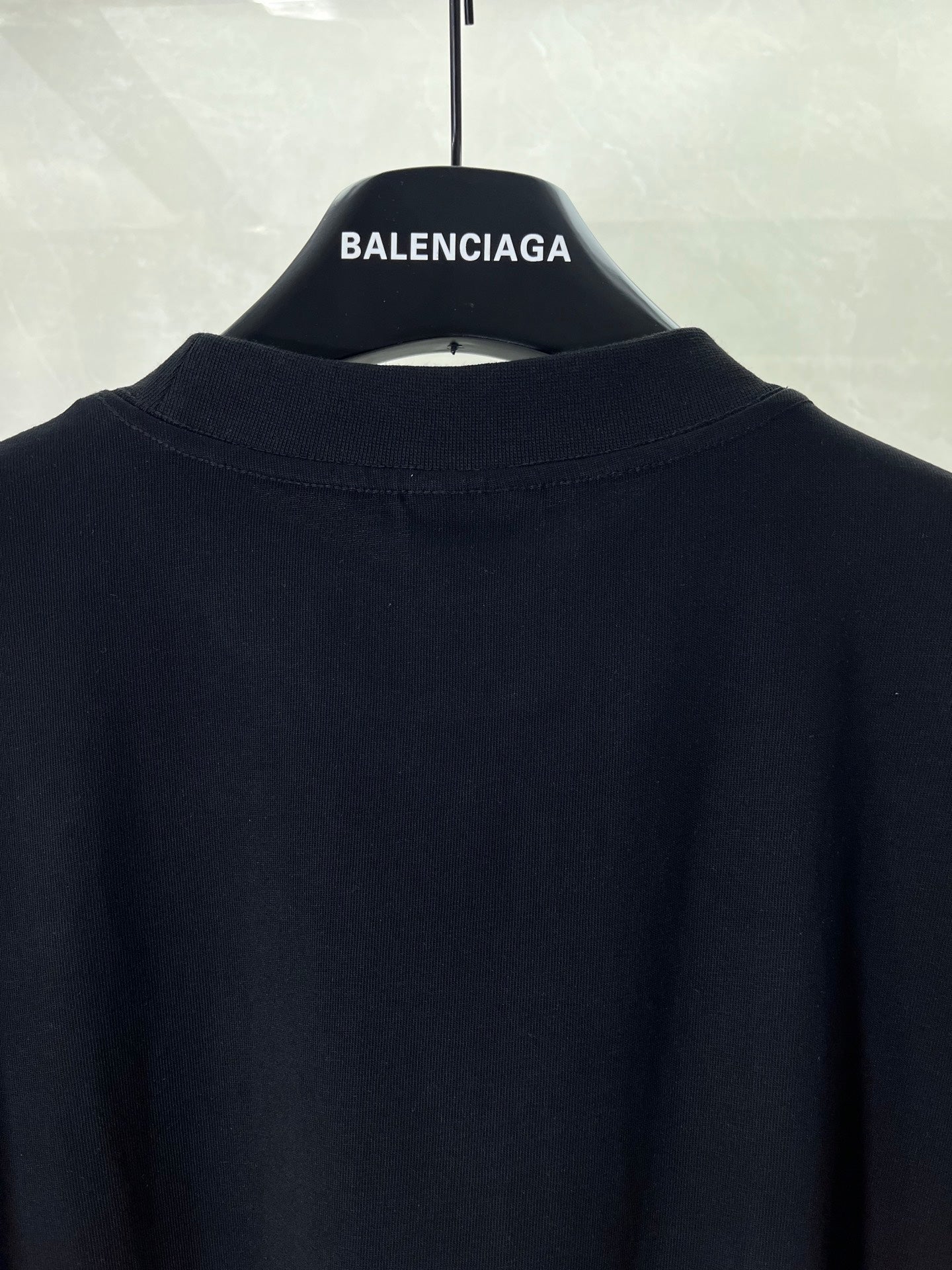 Balenciaga black T-shirt back neckline with small white logo text