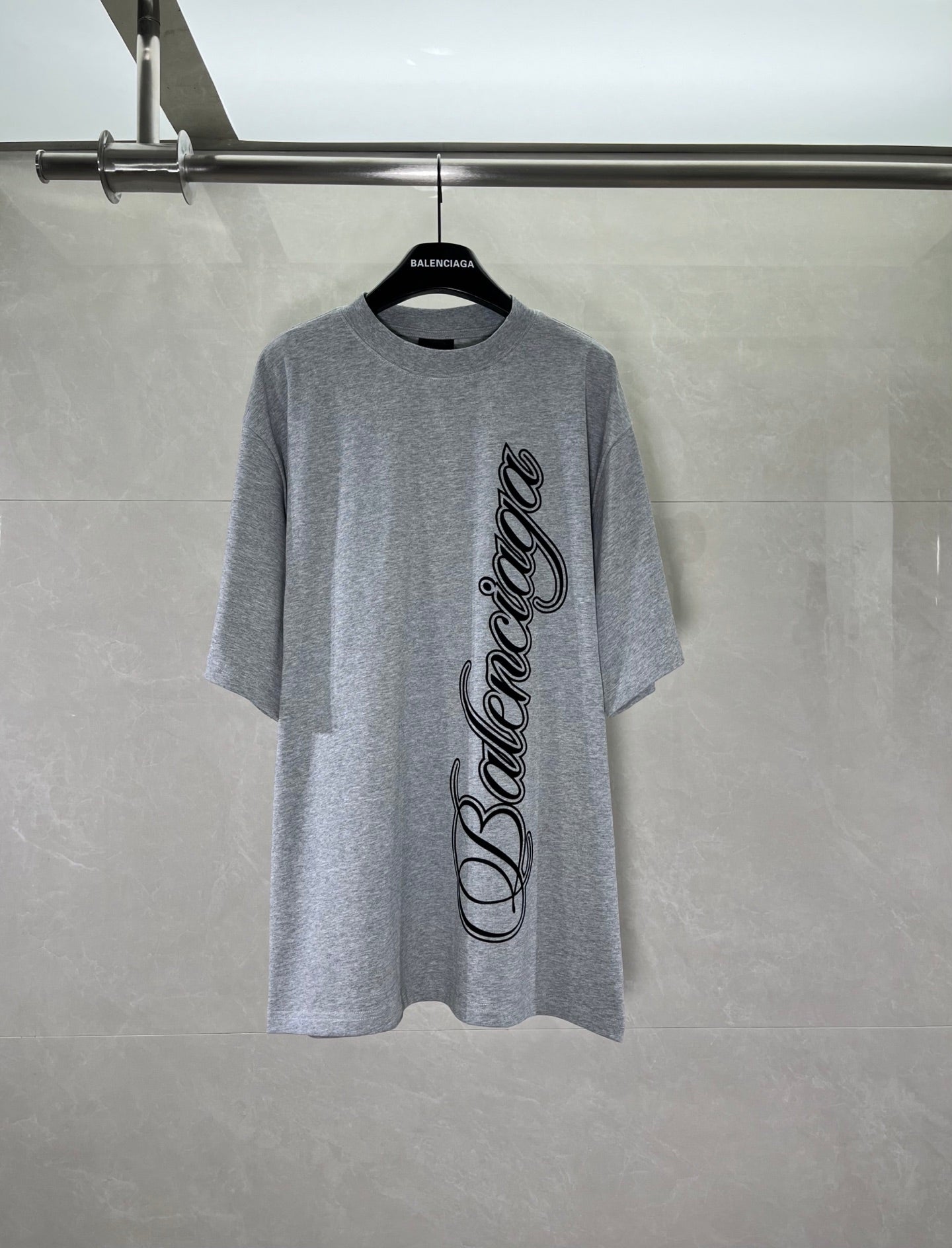 Heather gray short-sleeve T-shirt with black cursive graphic on front