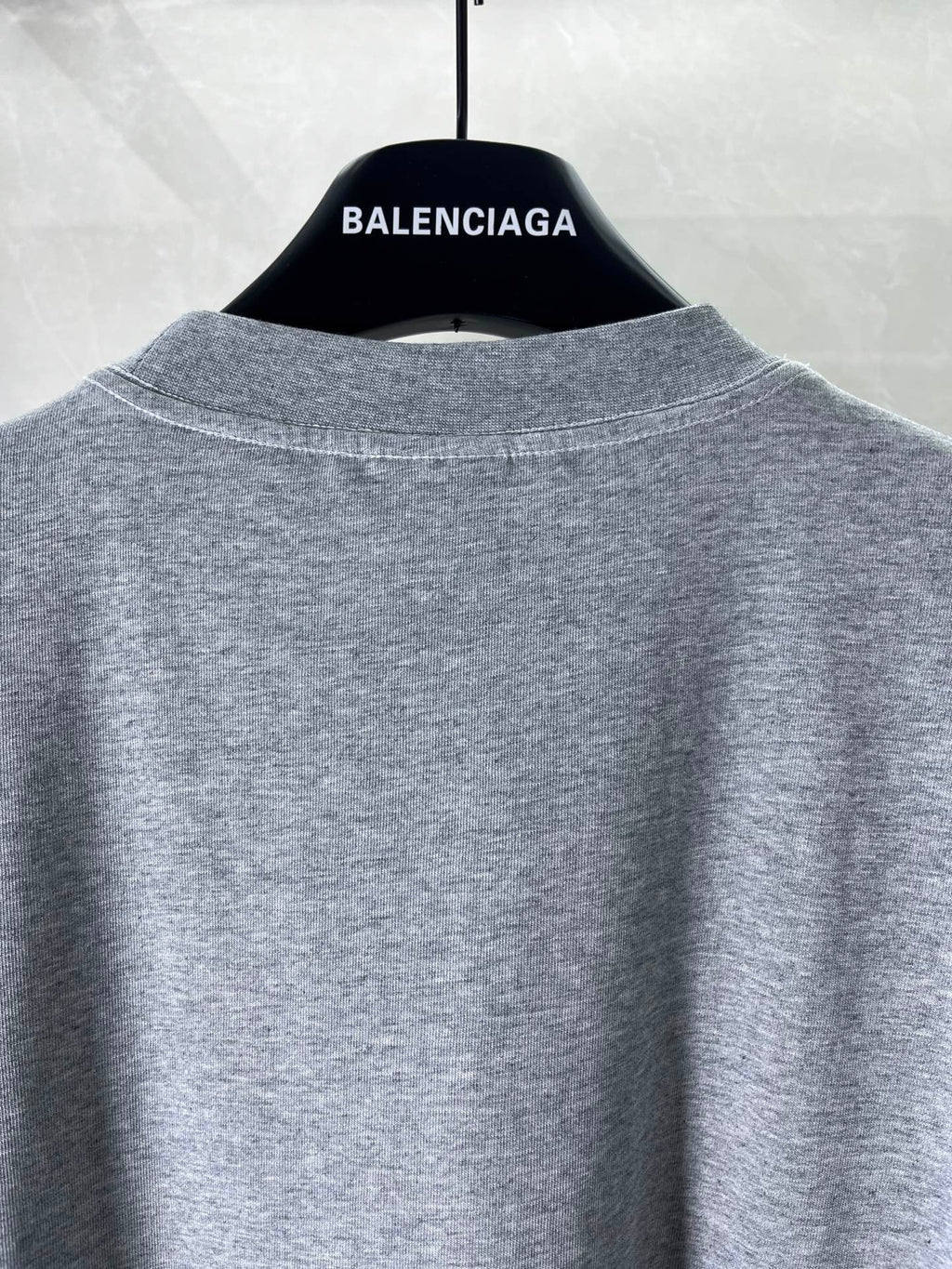 Heather gray crew-neck T-shirt back view, plain without graphics