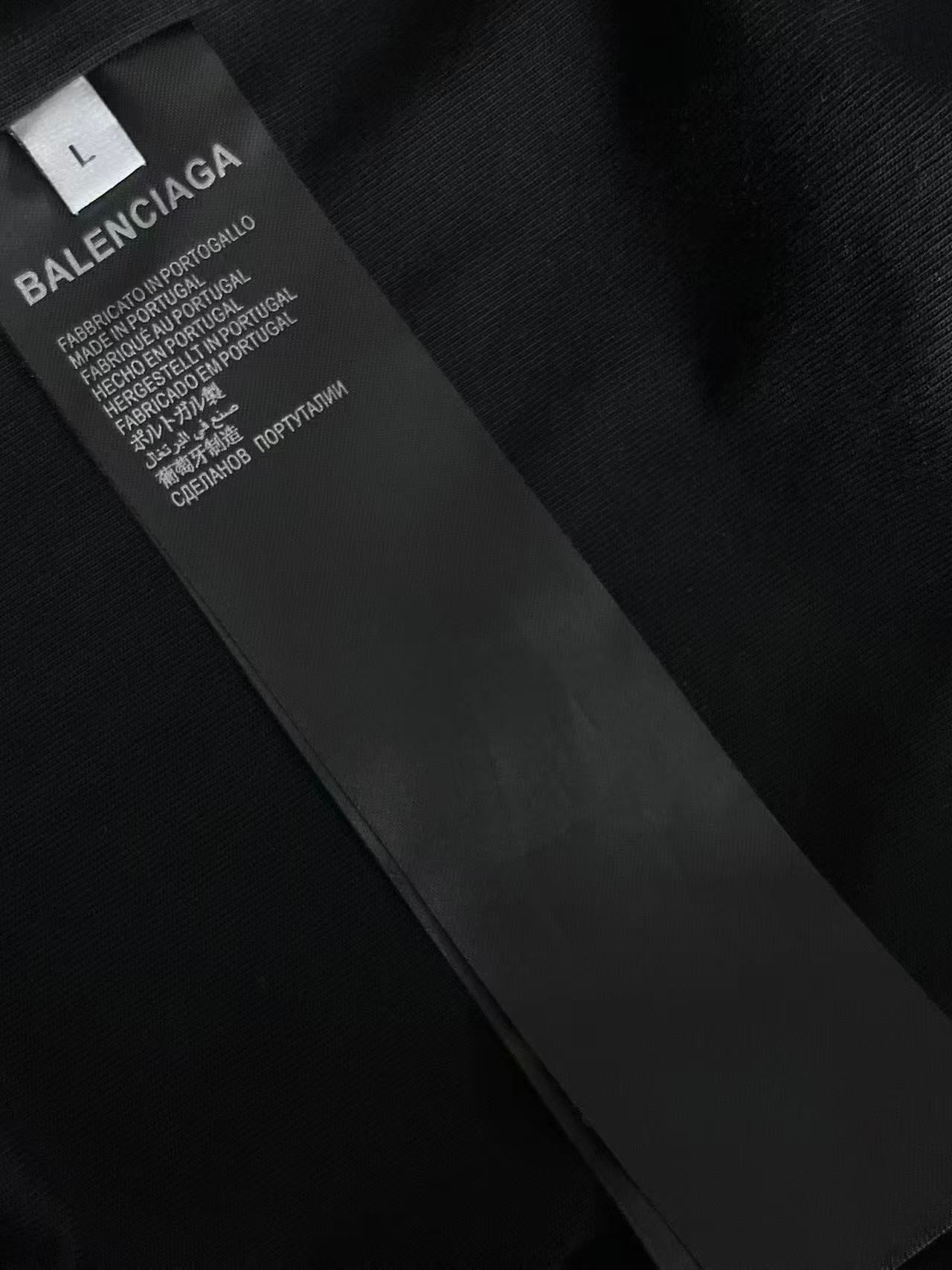 Black fabric care label on T-shirt tag with text and logo