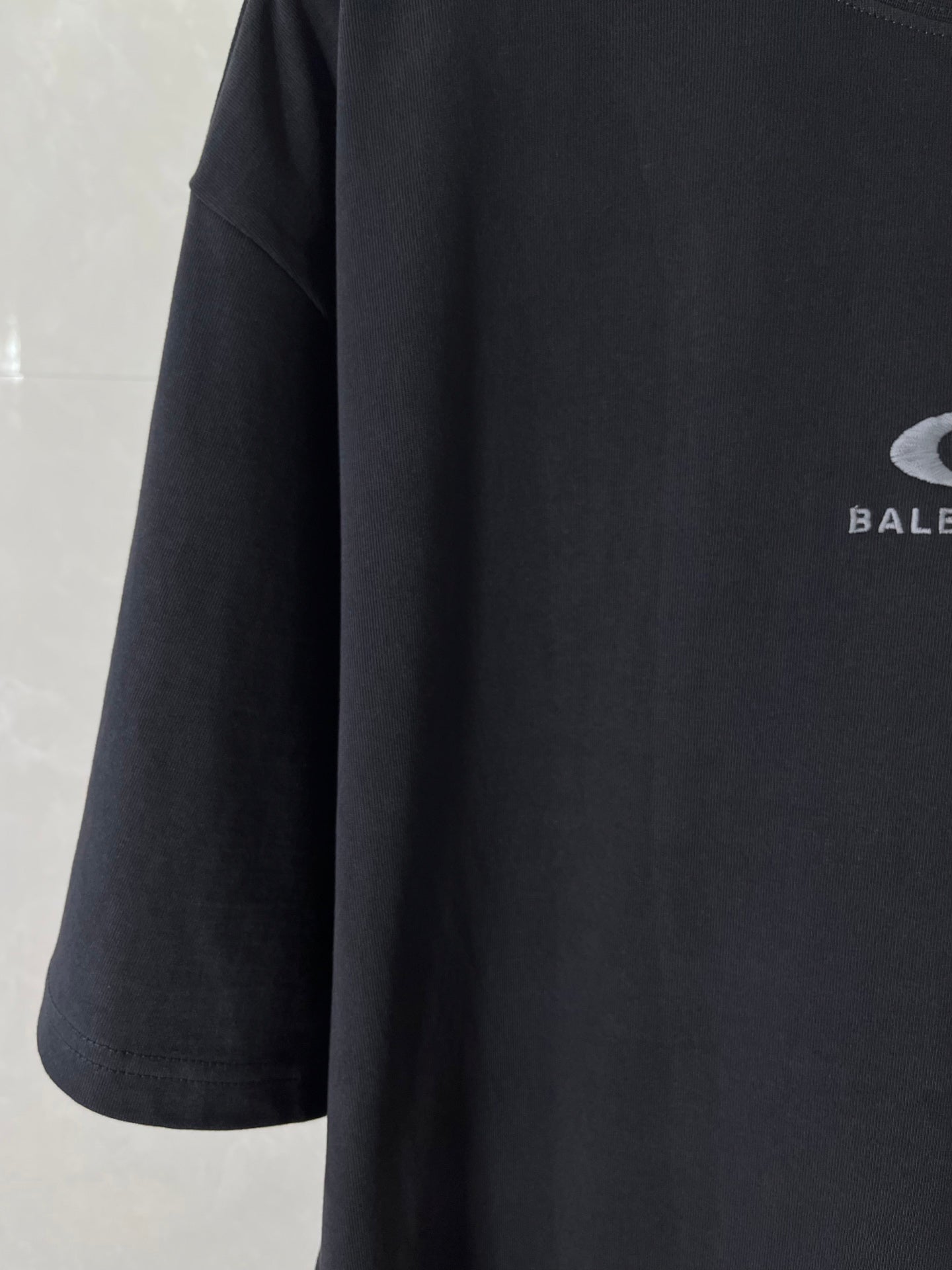 Navy short-sleeve crewneck T-shirt with partial BALENCIAGA logo print