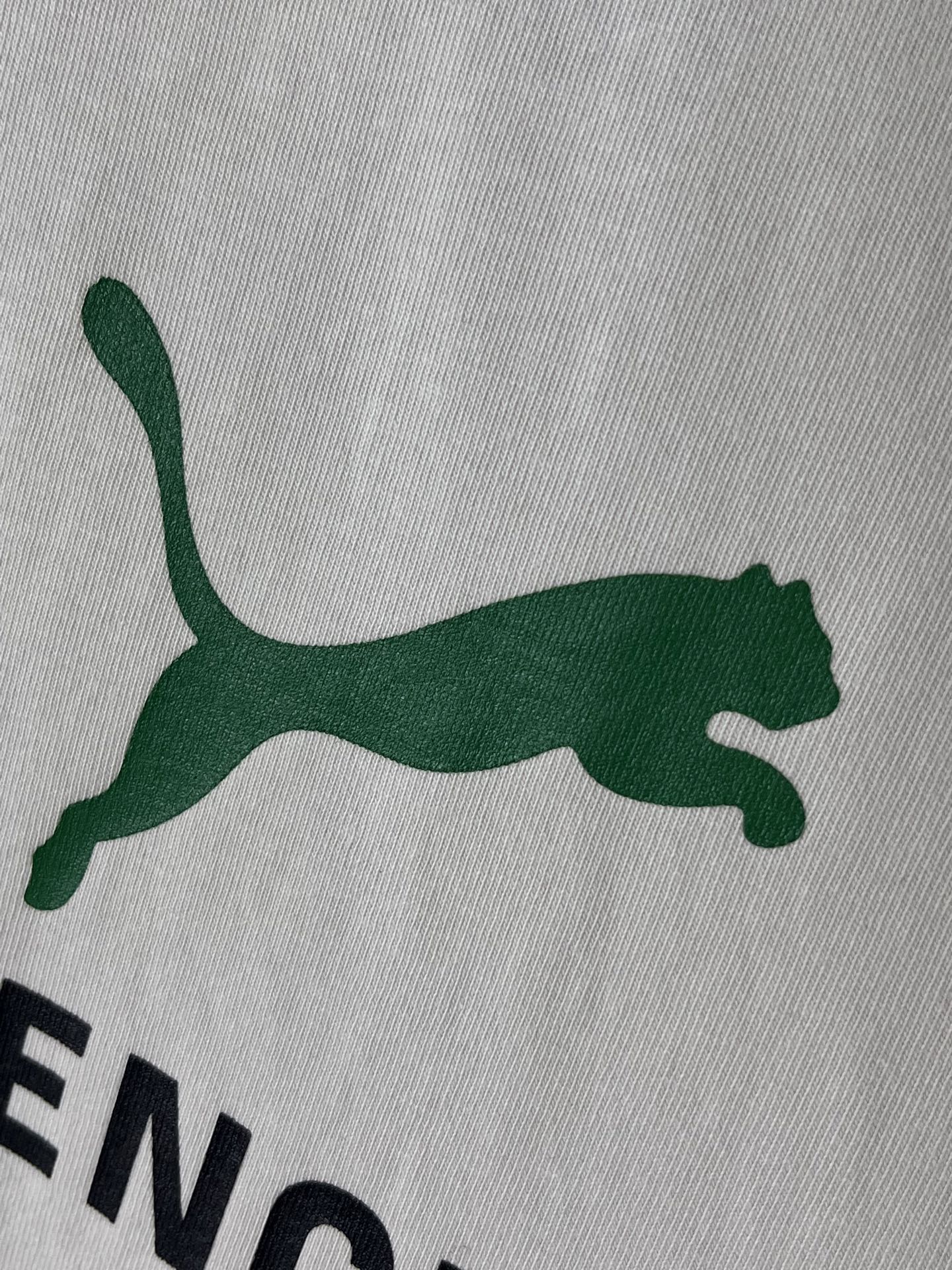 Green puma logo on white Balenciaga T-shirt