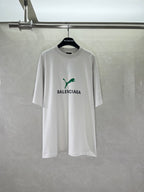 White Balenciaga short-sleeve T-shirt with green puma graphic and BALENCIAGA print