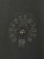 Dark gray T-shirt fabric with detailed embroidered cross emblem in center