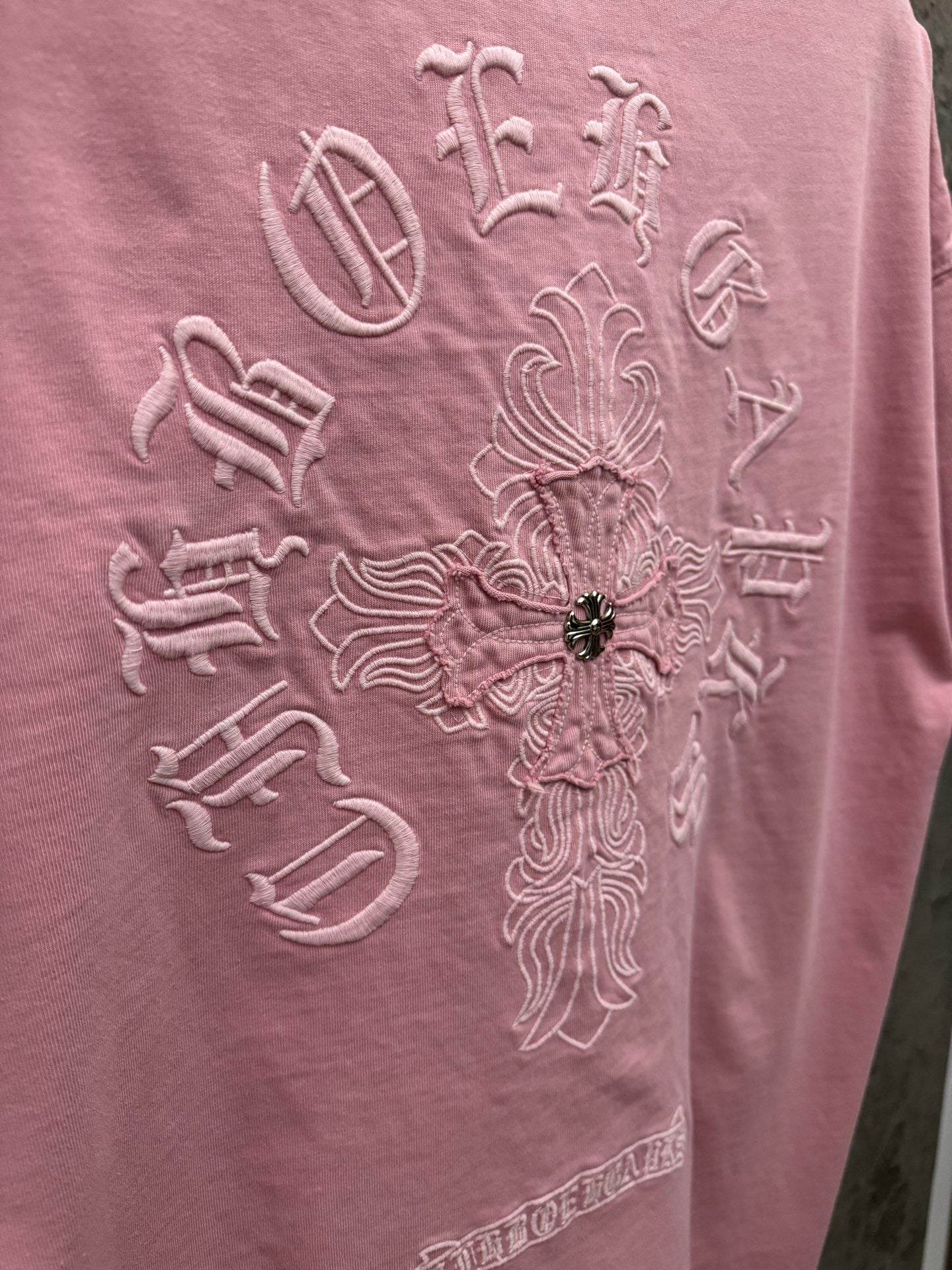Light pink T-shirt back embroidery detail with beaded center decoration