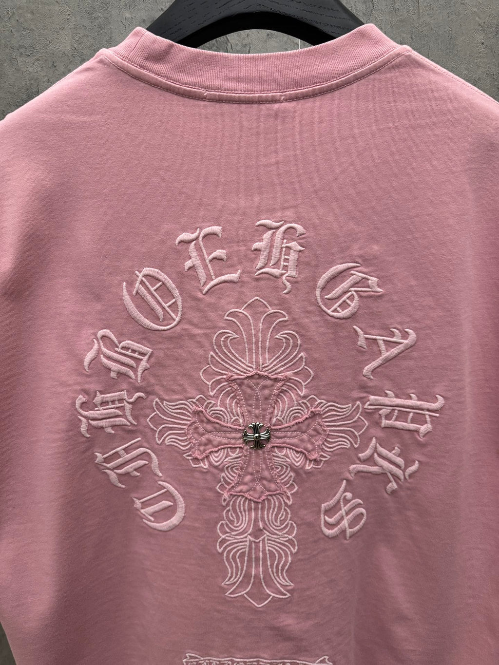 Light pink short-sleeve T-shirt back view with ornate floral embroidery