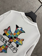 White crewneck T-shirt with close-up colorful cross and banner print