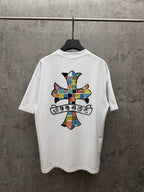 White crewneck T-shirt with large colorful cross graphic on the back