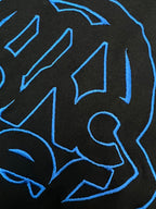 Black T-shirt close-up of blue outline logo graphic details