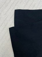 Black T-shirt sleeve and hem stitching detail