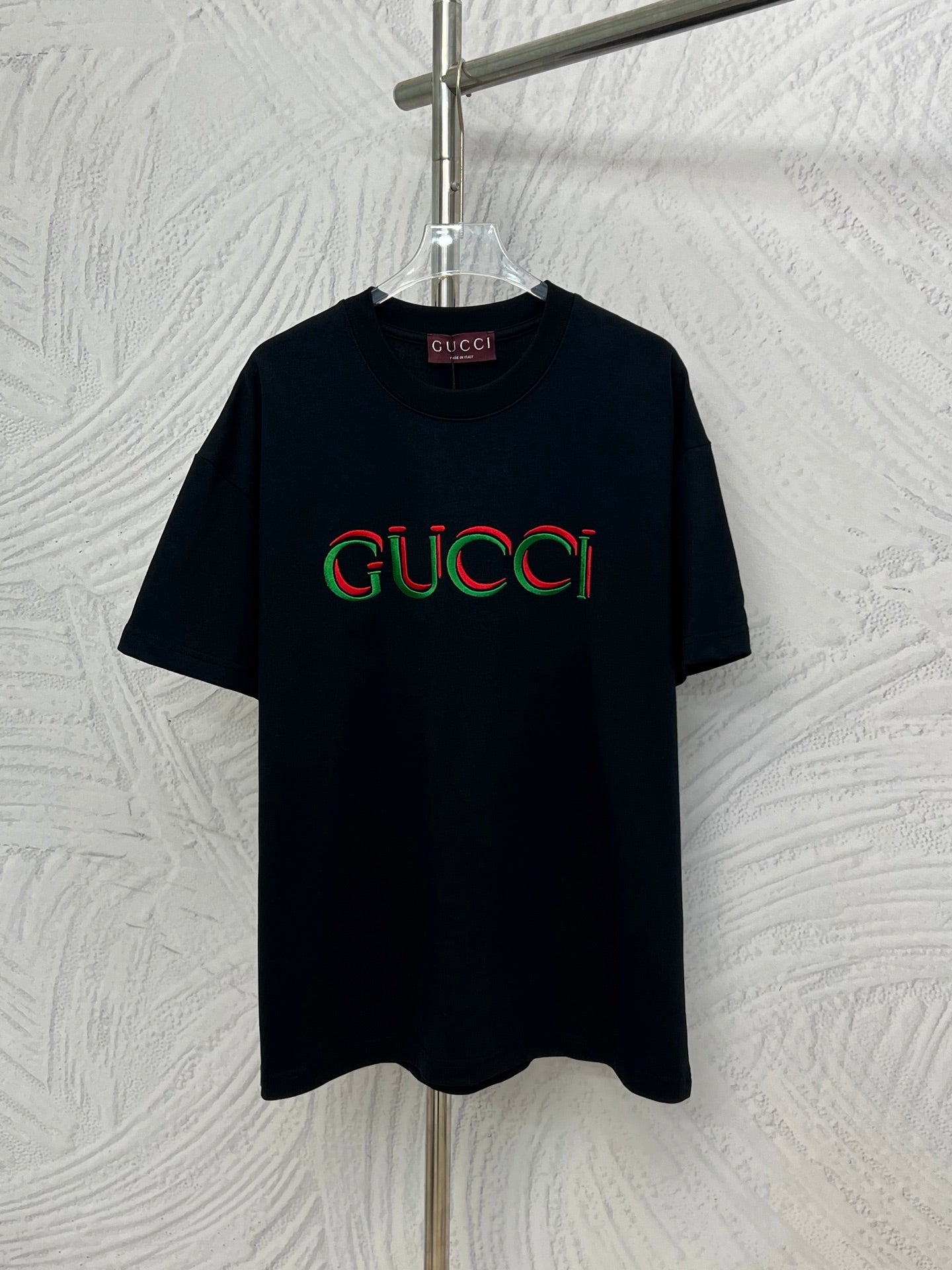 Black Gucci T-shirt with multicolor Gucci logo on the front