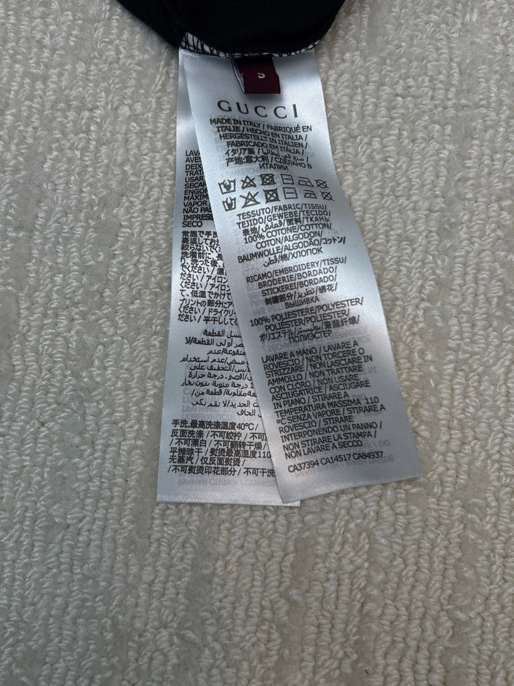 White care label inside black Gucci T-shirt neckline