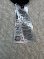White care label inside black Gucci T-shirt neckline