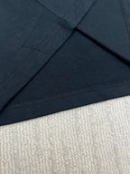 Black T-shirt hem and neckline seam detail