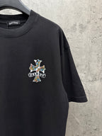 Black short-sleeve T-shirt with small multicolor cross chest graphic