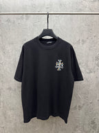 Black short-sleeve T-shirt with small multicolor cross chest graphic