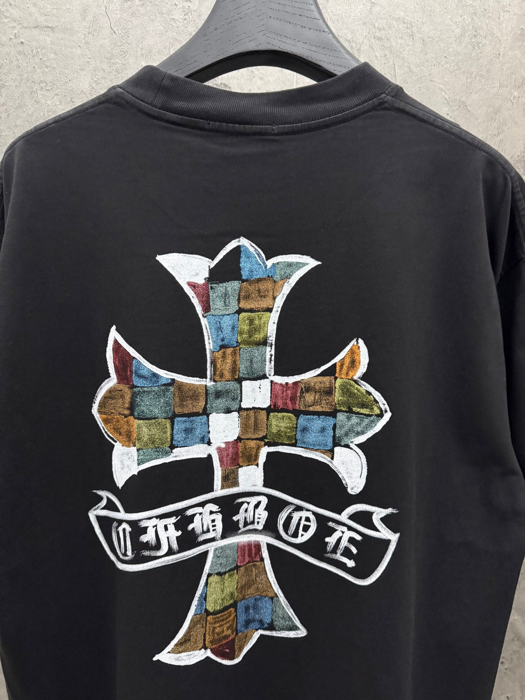 Black short-sleeve T-shirt back with large multicolor cross and ribbon
