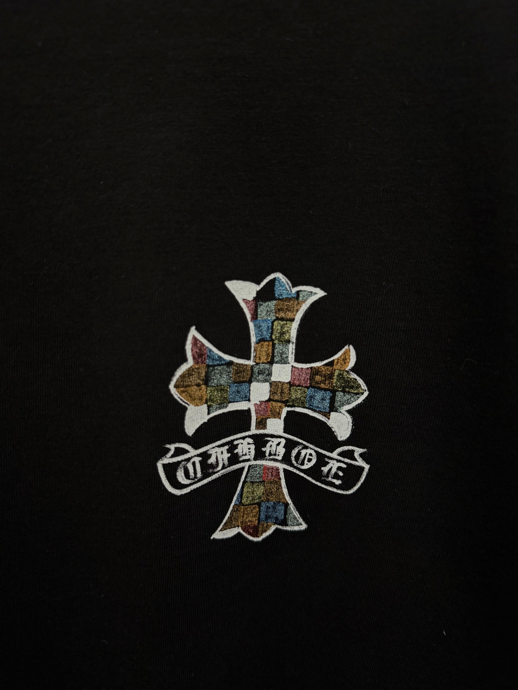 Black T-shirt with centered multicolor cross graphic print