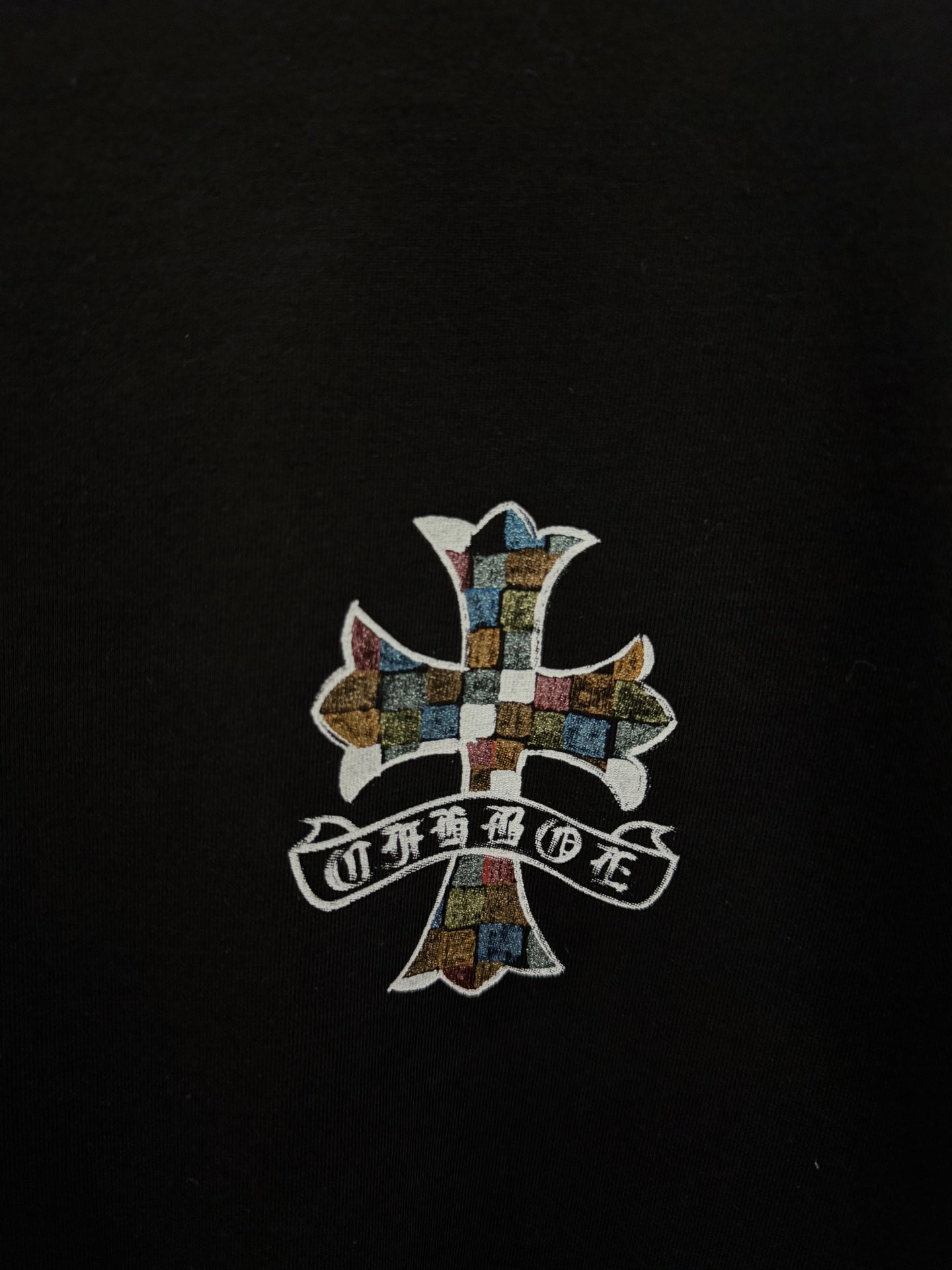 Black T-shirt with centered multicolor cross graphic print