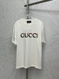 White Gucci T-shirt with multicolor Gucci logo print on the chest