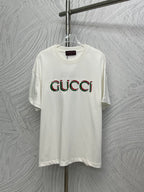 White Gucci T-shirt with multicolor Gucci logo print on the chest