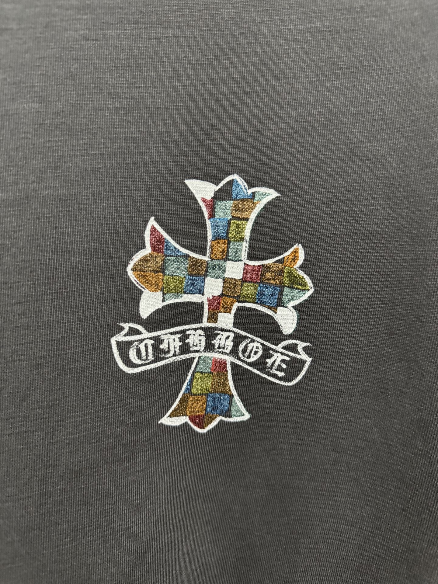 Multicolor cross graphic with ribbon text on dark gray short-sleeve T-shirt