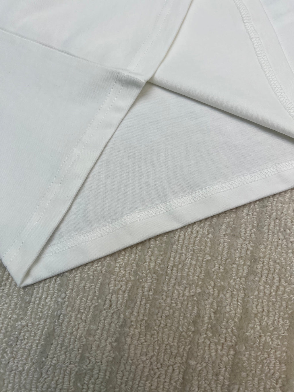 White T-shirt sleeves and side seam detail