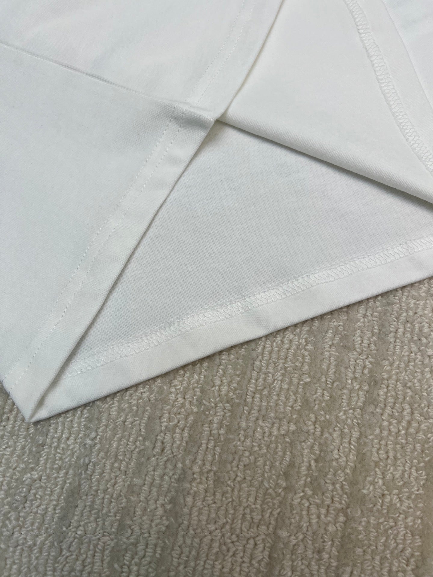 White T-shirt sleeves and side seam detail