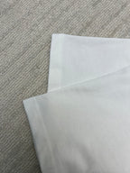 Folded white T-shirt fabric layer view