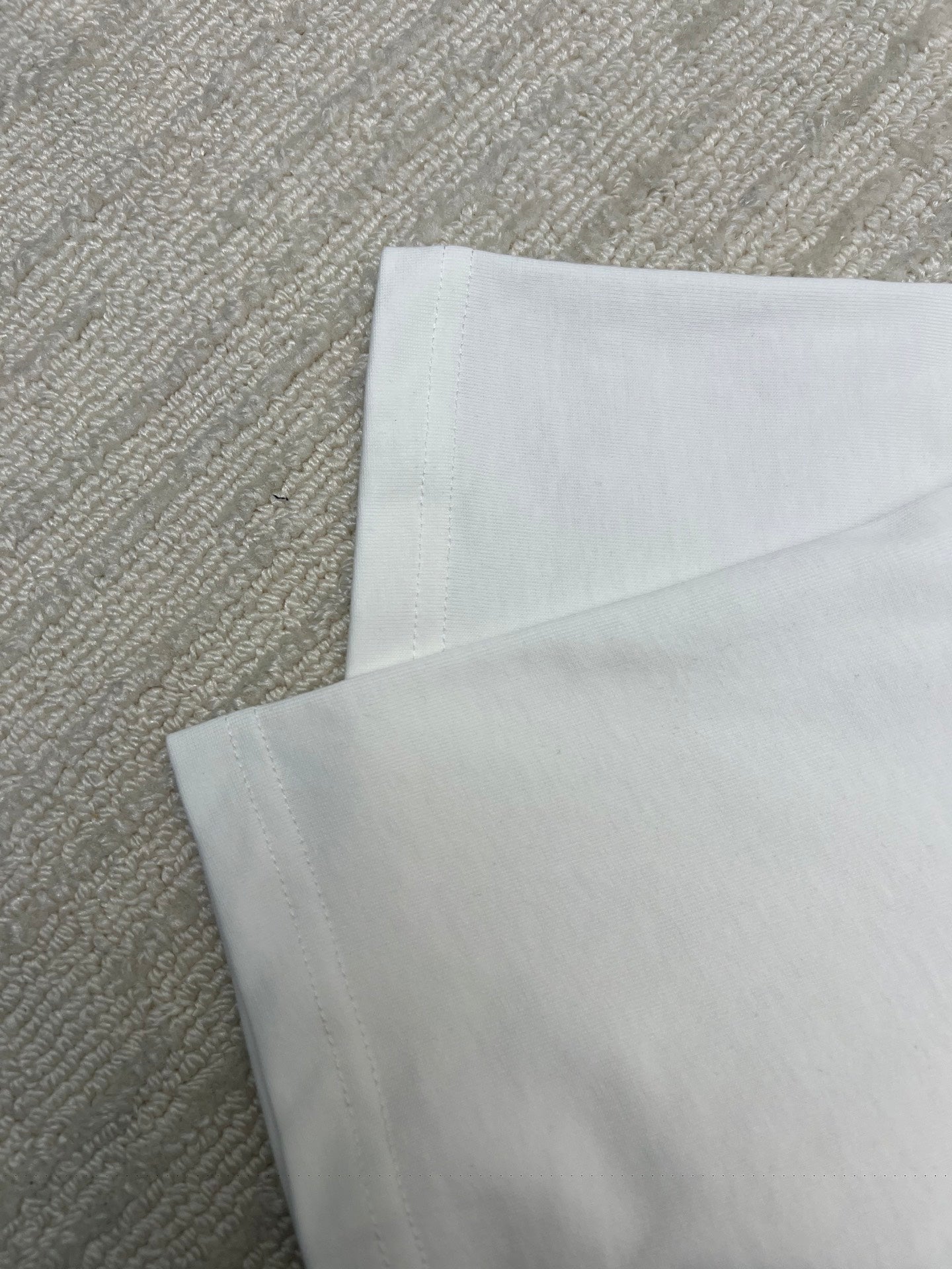 Folded white T-shirt fabric layer view