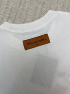 White T-shirt back collar with brown brand label
