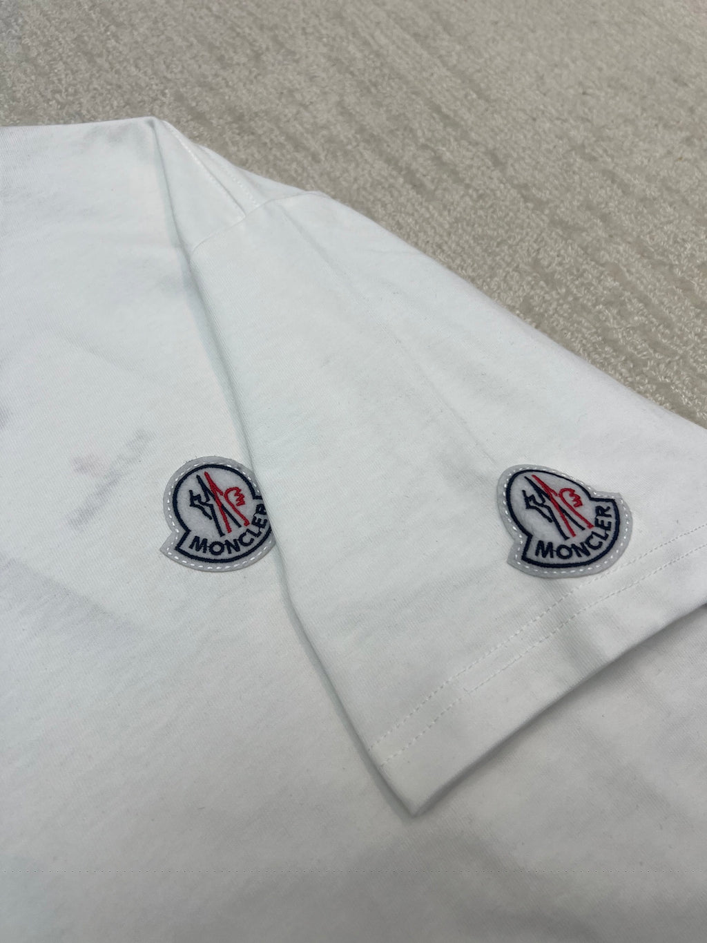 White Moncler T-shirt with logo patches on both sleeves, short sleeves