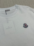 White Moncler T-shirt close-up, round neck and chest logo patch