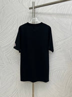 Black short-sleeve T-shirt with round Moncler logo patch on left sleeve