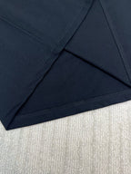 Black T-shirt hem with stitched seam detail