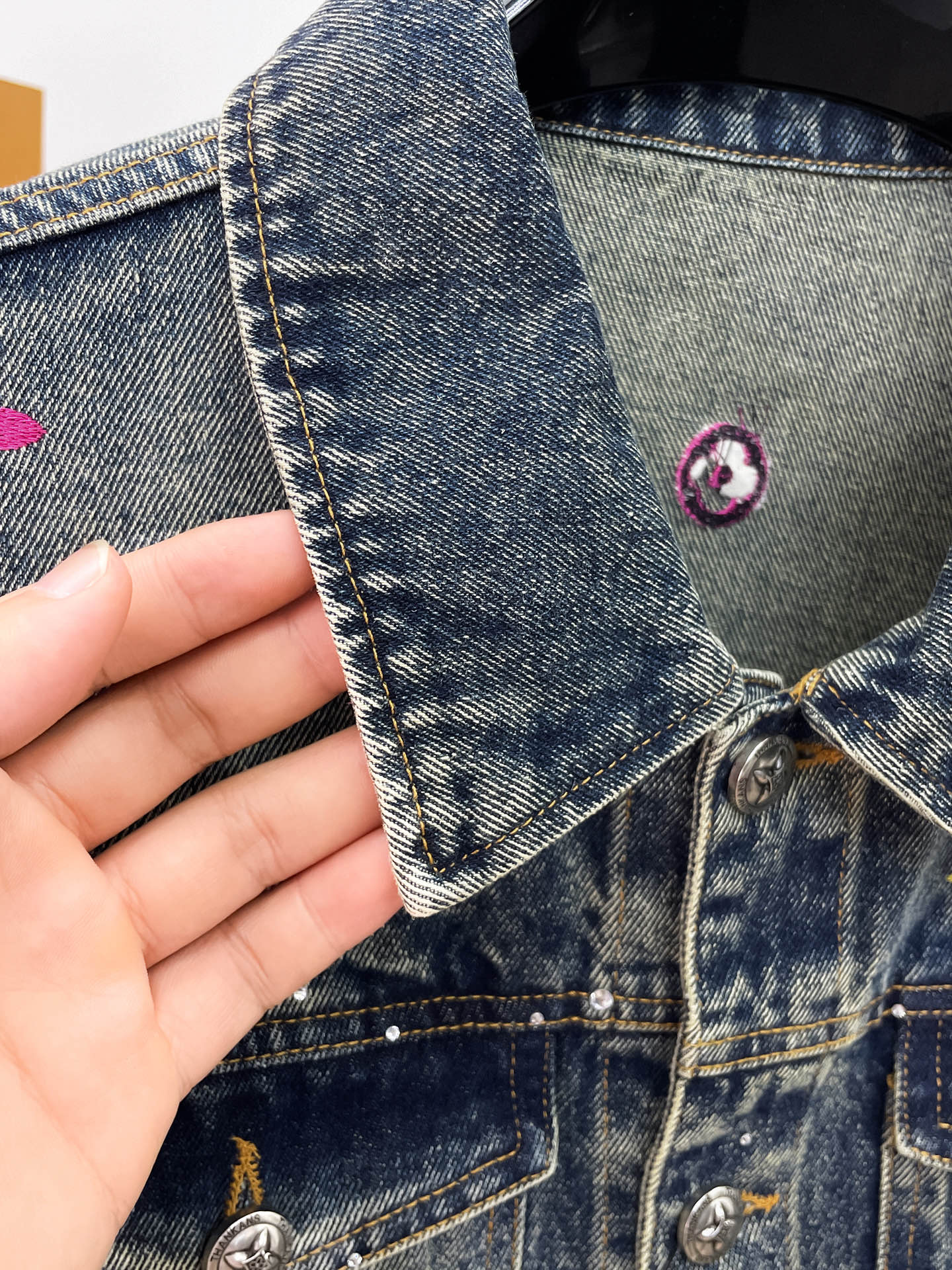 Louis Vuitton denim jacket with metal snap buttons and stitched cuffs