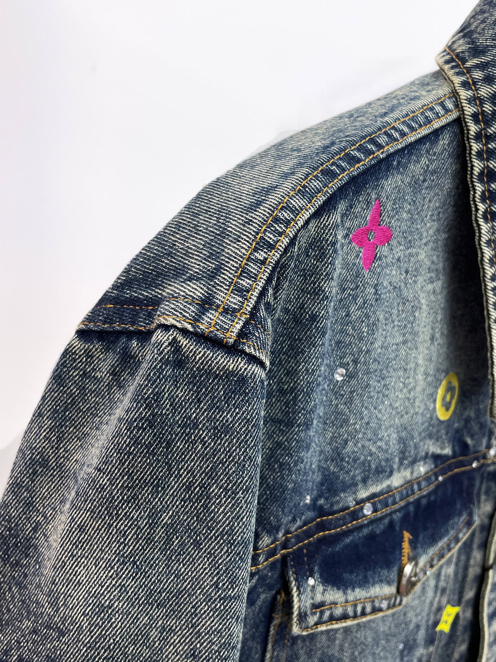 Louis Vuitton denim jacket collar with pink butterfly and yellow patches